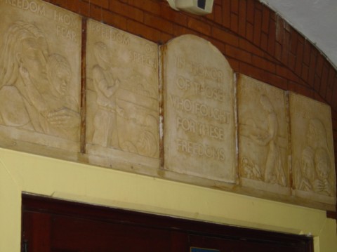 Close up of the Four Freedoms plaques above the library doorway.