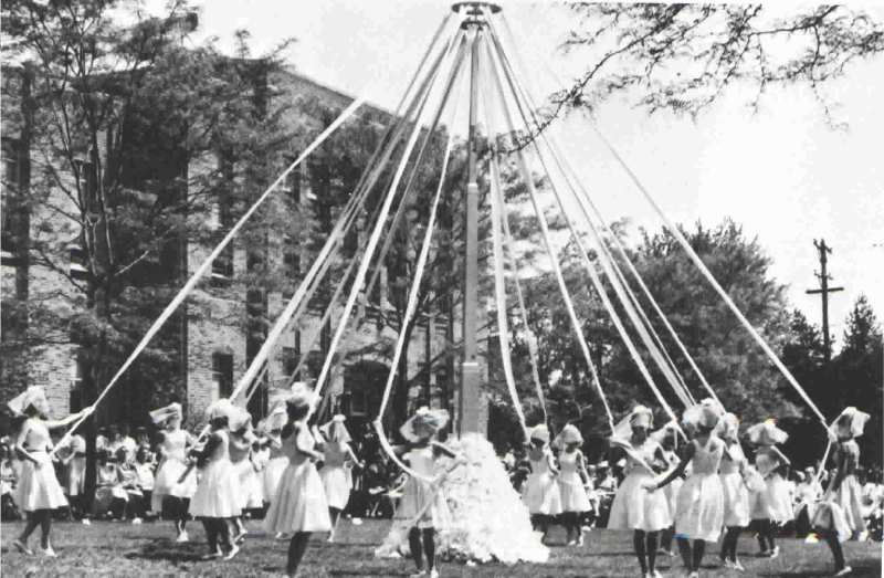 The traditional May Pole Dance adds beauty to the 1965 May Day celebrations. 