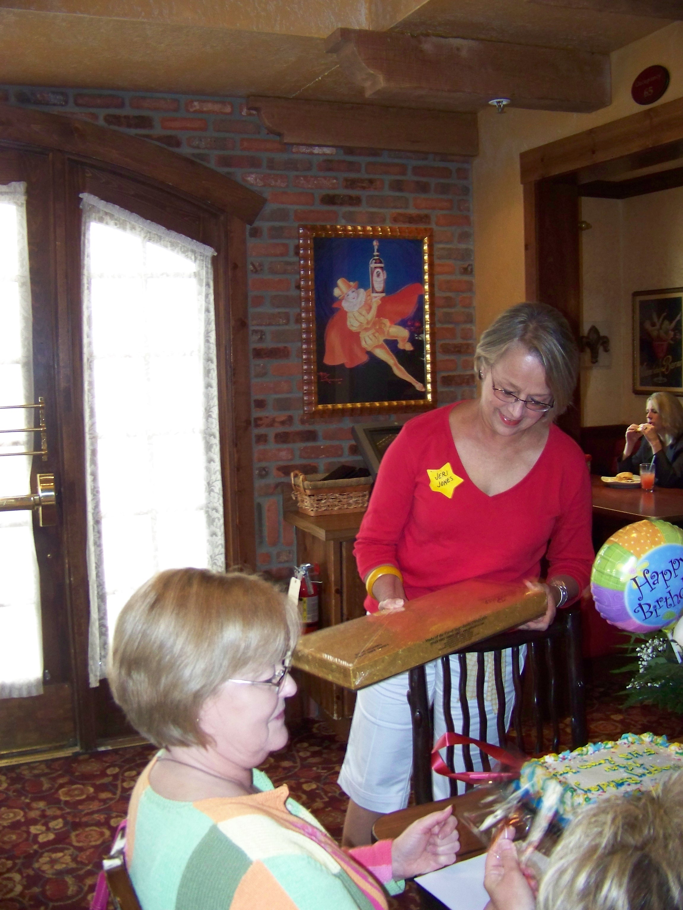Jeri Jones opening the box of Esther Price chocolates Sandie Sturdivant sent in memory of Nancy. There was so much candy that everyone had to take a bag full home! Thank you Sandie.