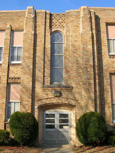 Exterior of FHS showing the World War II window by local artists Robert and Gertrude Metcalf.