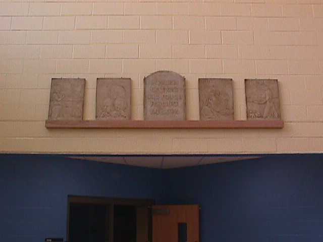 The Four Freedoms plaques once hung above Fairview High School's library door.  They are now displayed in the new school.