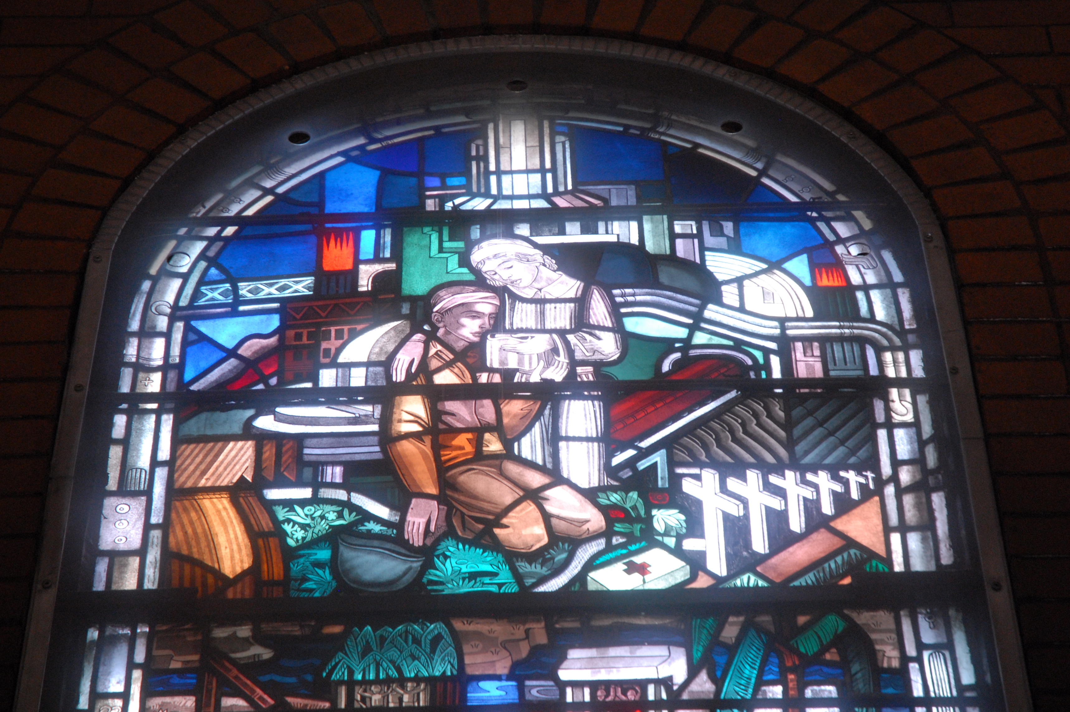Top section of the World War II stained glass window created by Robert and Gertrude Metcalf.