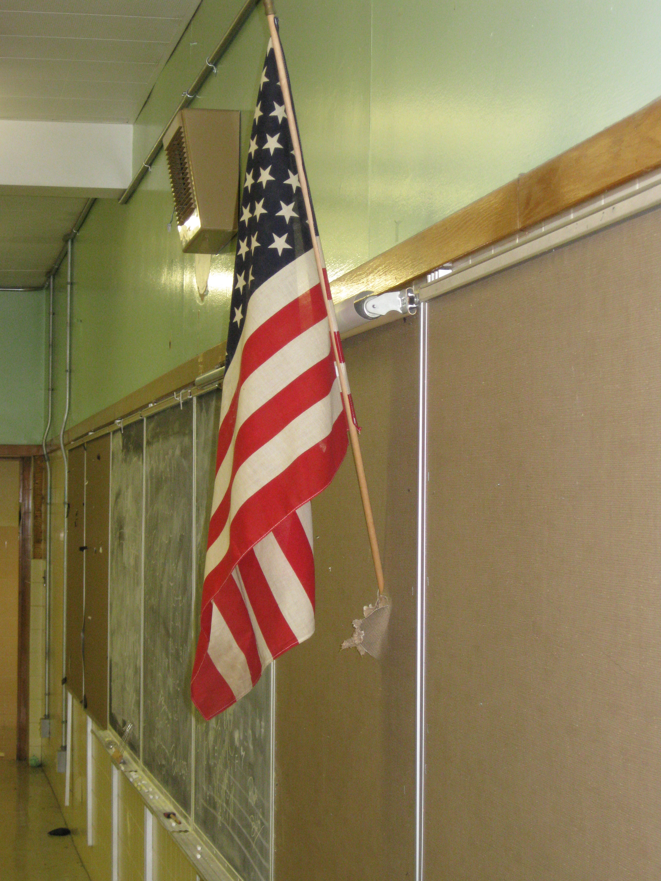 Stars and Stripes still standing. Is it being held up by tape?