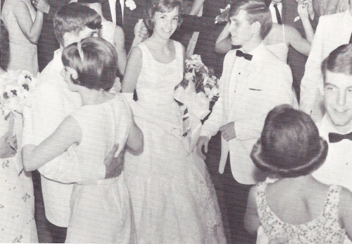 At the evening's 1966 May Day Dance are Queen, Bonnie Bloom and King, Reed Putnam. Both are shown in the center of the photo.  Also included are the May Day Attendants. Lonn Jackson and Nancy Mathews, Junior Atts. Dwight Woessner and Linda Cremeens, Senio