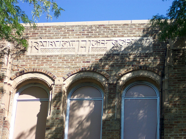 The upper facade of Fairview High School above the front entrance facing Philadelphia Drive.